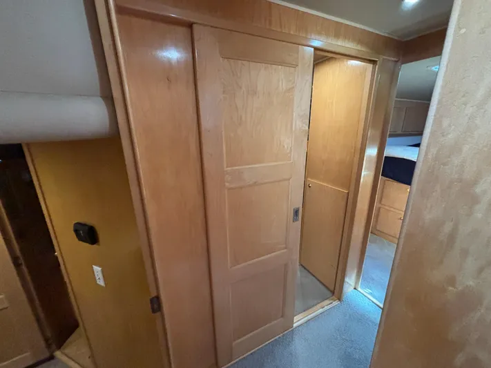 Orca Belle Yacht Photos Pics Interior of a 2000 Navigator 5300 RV with wooden sliding door and carpeted floor.