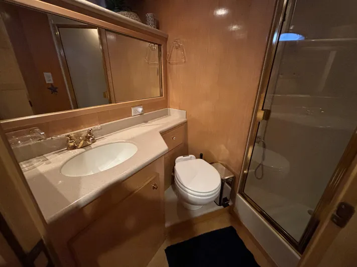 Orca Belle Yacht Photos Pics Luxurious bathroom in 2000 Navigator 5300 yacht with sink, toilet, and shower.