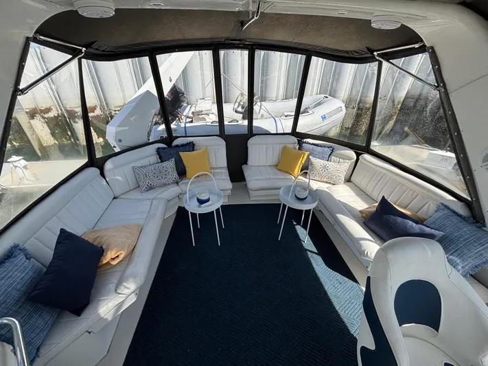 Orca Belle Yacht Photos Pics Luxurious interior of 2000 Navigator 5300 yacht with plush seating and elegant decor.