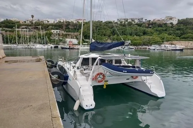 Seis Al Mar Yacht Photos Pics 2018 Seawind 1260 catamaran docked in a scenic marina.