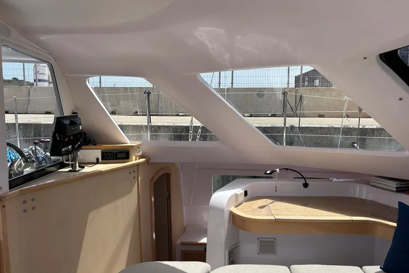 Seis Al Mar Yacht Photos Pics Interior of 2018 Seawind 1260 catamaran with modern navigation equipment and sleek design.