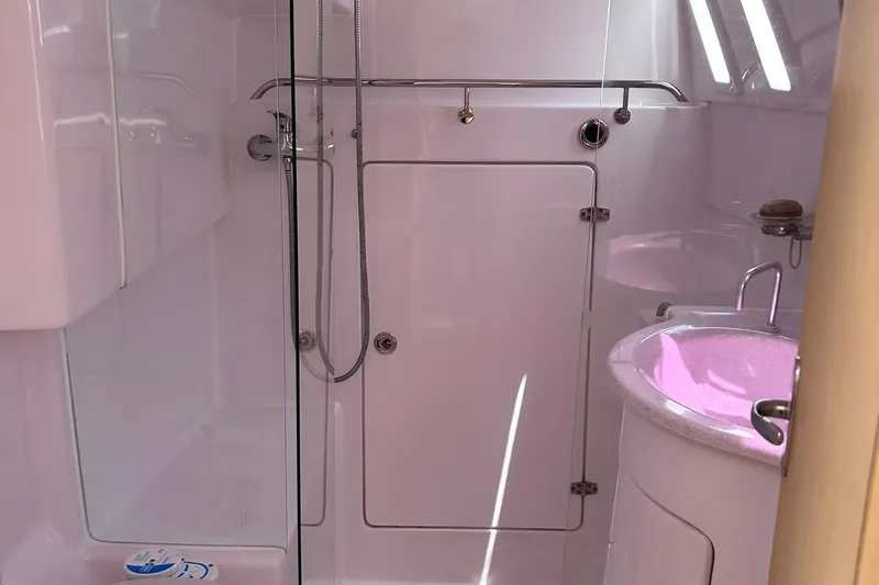 Seis Al Mar Yacht Photos Pics Bathroom interior of 2018 Seawind 1260 catamaran with shower and sink.