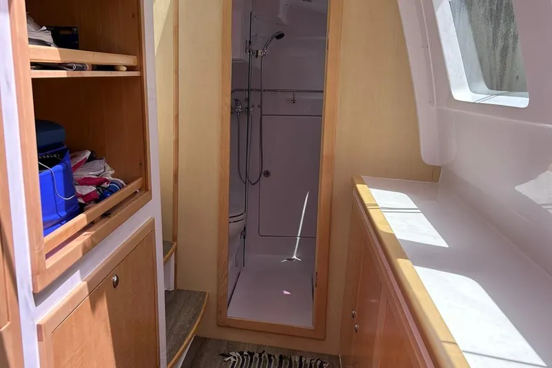 Seis Al Mar Yacht Photos Pics Interior of 2018 Seawind 1260 yacht showing bathroom and storage area.