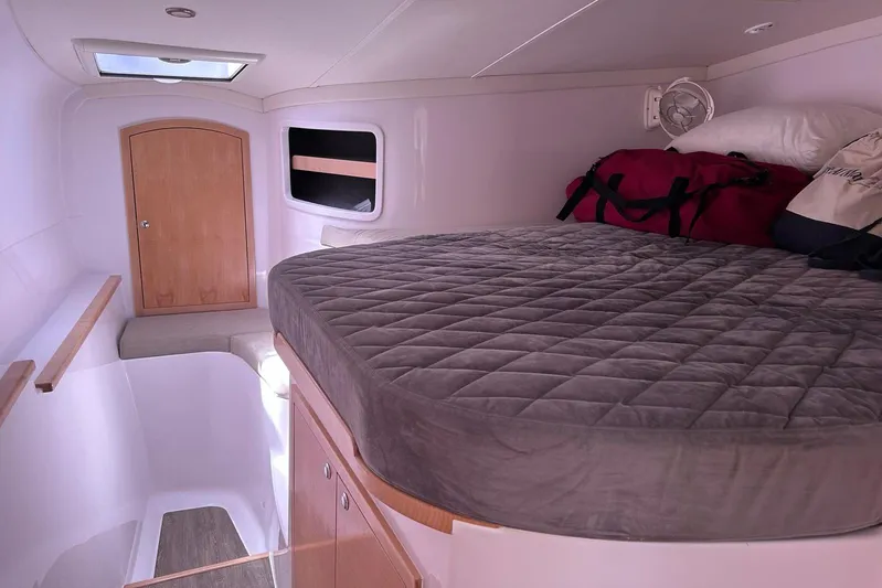 Seis Al Mar Yacht Photos Pics Cozy cabin interior of 2018 Seawind 1260 catamaran with bed and storage.