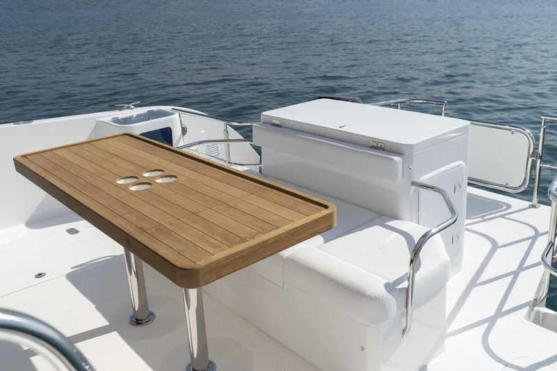  Yacht Photos Pics Luxurious SilverCAT 40LUX yacht deck with wooden table, white seating, and ocean view, 2026 model.