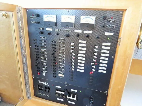 Orca Belle Yacht Photos Pics Electrical control panel of a 2000 Navigator 5300 boat, featuring gauges and switches.