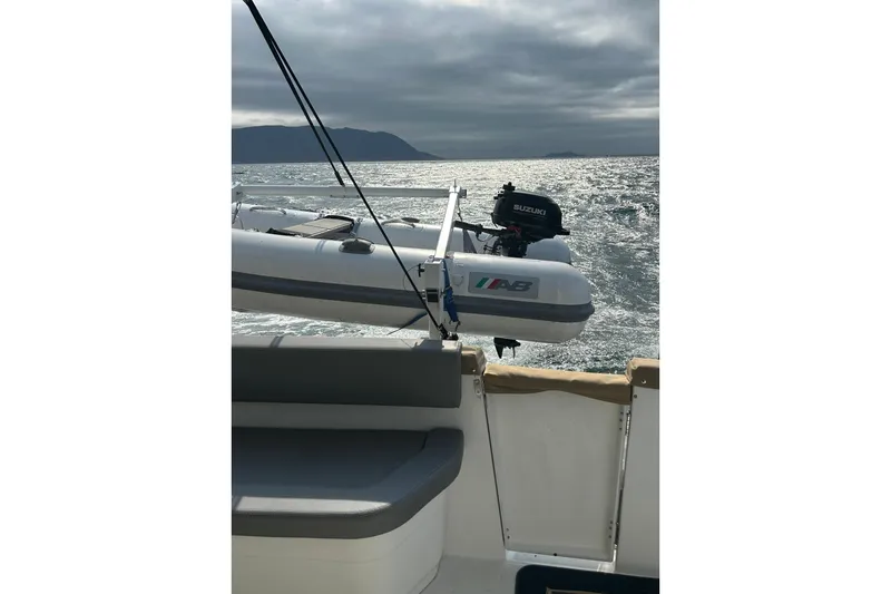 Sante Yacht Photos Pics 2013 Beneteau Swift Trawler 34 Fly with dinghy on open water.