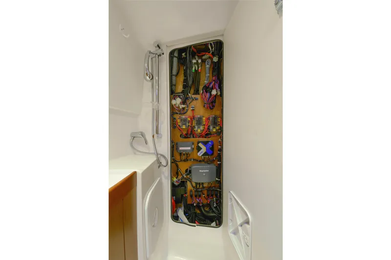 Sante Yacht Photos Pics Electrical panel inside 2013 Beneteau Swift Trawler 34 Fly, showcasing wiring and components.