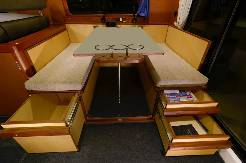 Sante Yacht Photos Pics Interior of 2013 Beneteau Swift Trawler 34 Fly with seating and storage drawers.