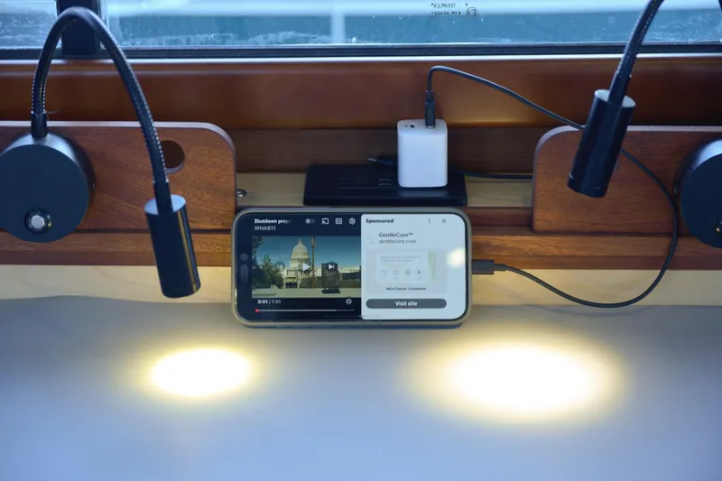 Sante Yacht Photos Pics Interior of 2013 Beneteau Swift Trawler 34 Fly with phone and reading lights.