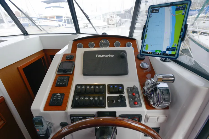 Sante Yacht Photos Pics Helm of 2013 Beneteau Swift Trawler 34 Fly with navigation equipment and controls.