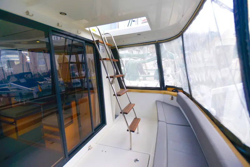 Sante Yacht Photos Pics Interior view of 2013 Beneteau Swift Trawler 34 Fly with seating and ladder.