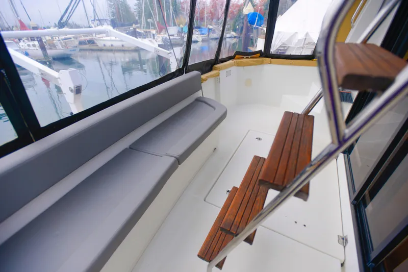 Sante Yacht Photos Pics 2013 Beneteau Swift Trawler 34 Fly interior with seating and wooden steps.