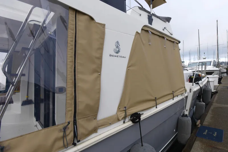 Sante Yacht Photos Pics 2013 Beneteau Swift Trawler 34 Fly docked with beige canvas cover.