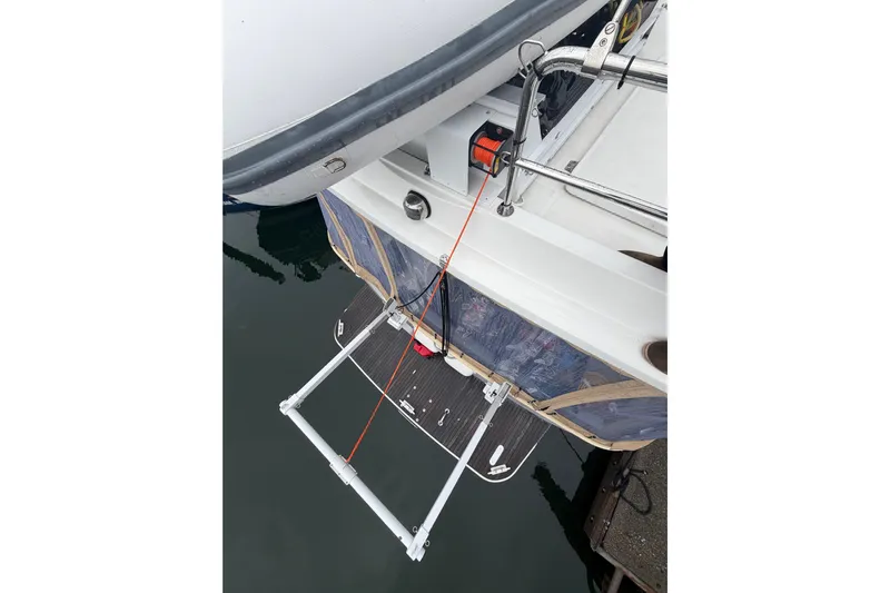 Sante Yacht Photos Pics 2013 Beneteau Swift Trawler 34 Fly with swim platform and ladder at dock.