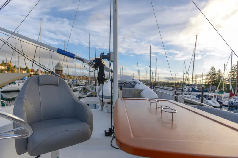 Sante Yacht Photos Pics 2013 Beneteau Swift Trawler 34 Flybridge with marina view, featuring helm seat and table.