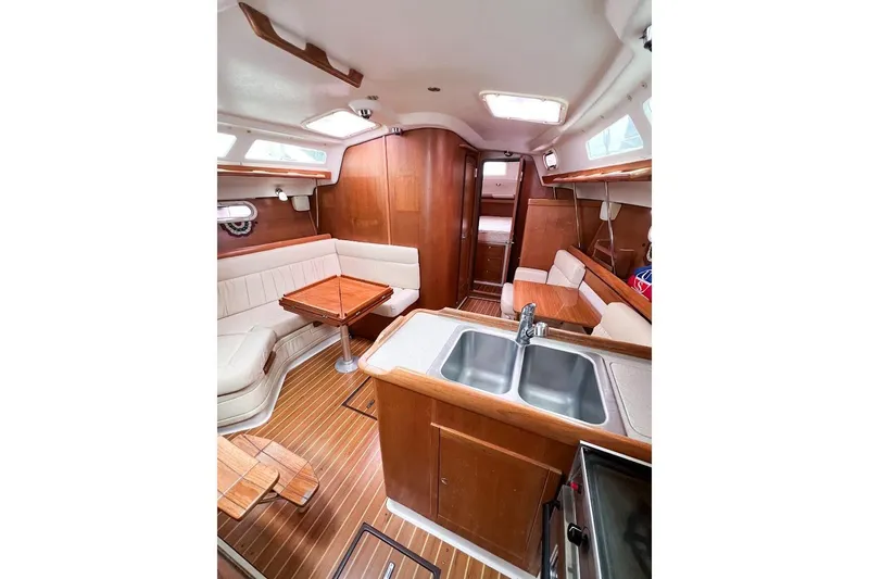 Just Cause Yacht Photos Pics Salon looking fwd with wood finish and cozy seating area.