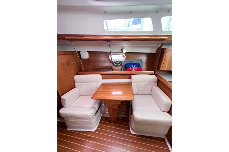 Just Cause Yacht Photos Pics Salon starboard side cushioned lounge seating.