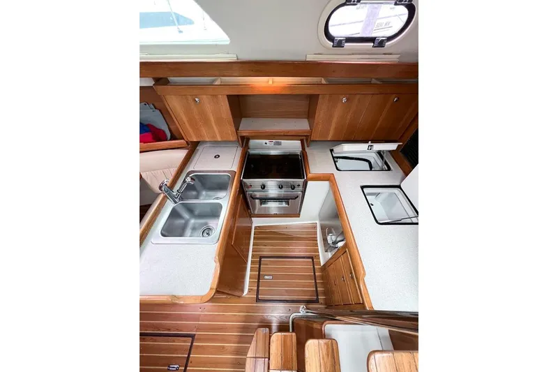 Just Cause Yacht Photos Pics Galley view of sinks, stove top, oven, and refrigerator access from top and front