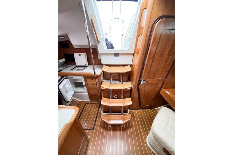 Just Cause Yacht Photos Pics Additional view of refrigerator access from top & front, and steps to cockpit