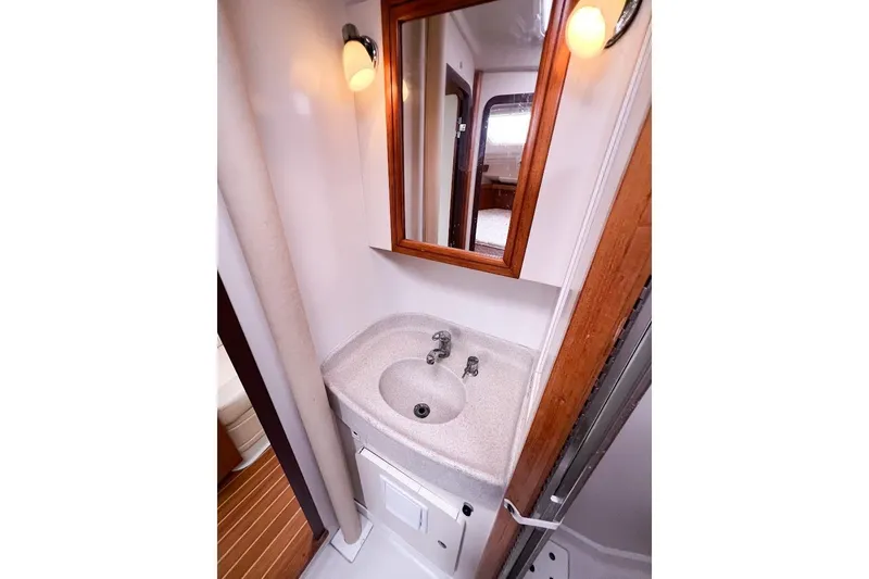 Just Cause Yacht Photos Pics Bathroom sink featuring mirror and lighting