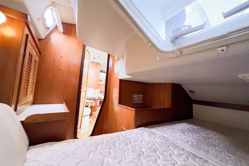 Just Cause Yacht Photos Pics Aft berth featuring cozy cabin, large hatch for ventilation and natural lighting