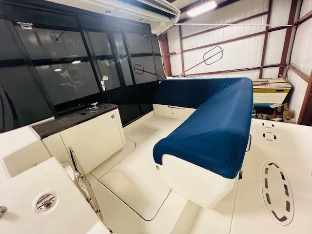  Yacht Photos Pics 2016 Sea Ray 470 Sundancer yacht interior with blue-covered seating in a storage facility.
