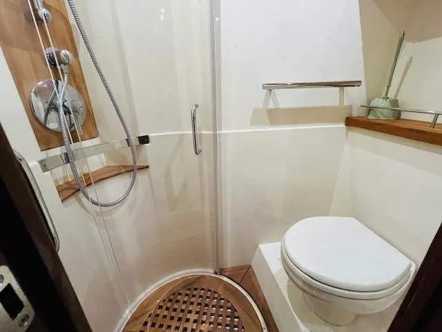  Yacht Photos Pics Bathroom interior of 2016 Sea Ray 470 Sundancer yacht with shower and toilet.