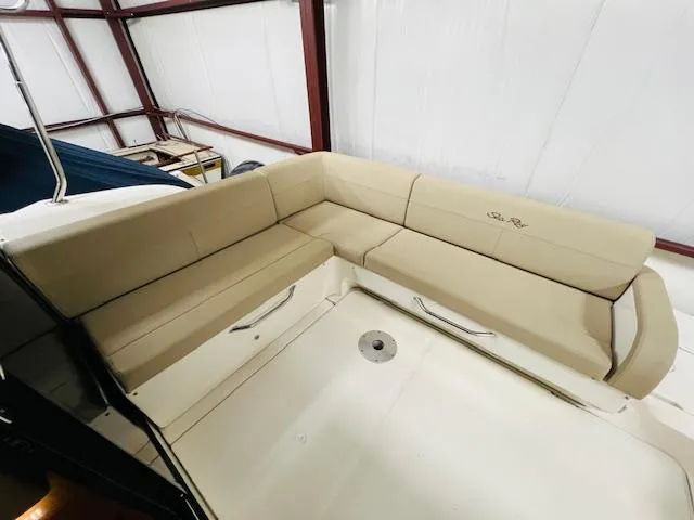  Yacht Photos Pics 2016 Sea Ray 470 Sundancer boat interior with beige seating in a storage facility.