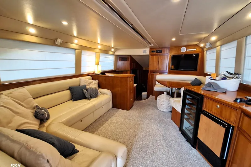 Pope Yacht Photos Pics Luxurious interior of 2003 Riviera Marine Riviera 51 yacht with plush seating and modern amenities.