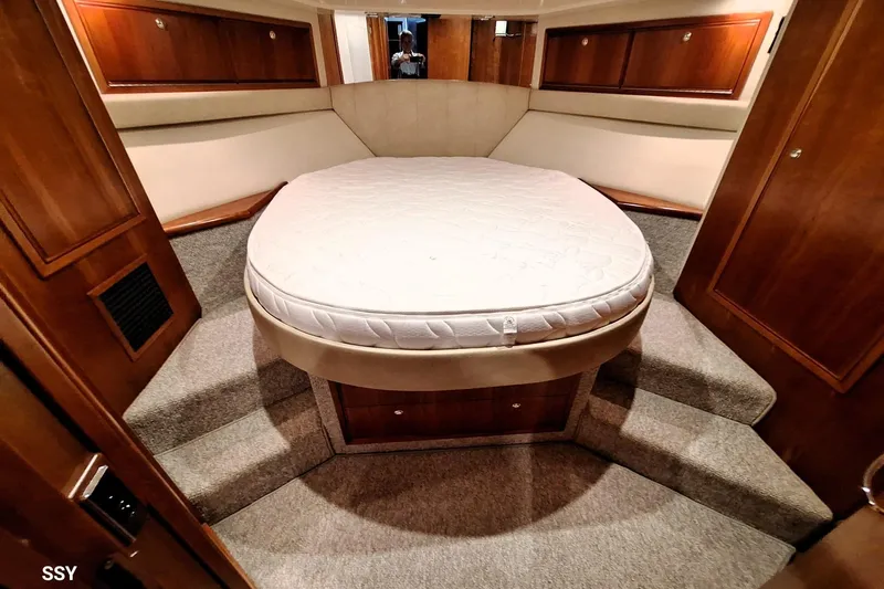 Pope Yacht Photos Pics Luxurious bedroom interior of 2003 Riviera Marine Riviera 51 yacht with cozy bed.