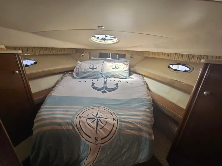 Why Not Yacht Photos Pics Cozy bedroom in 2005 Meridian 381 Sedan yacht with nautical-themed bedding.