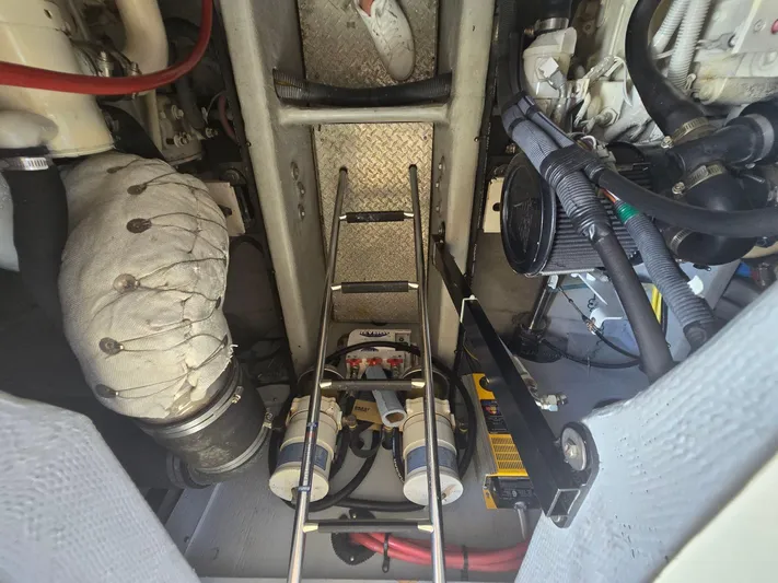 Why Not Yacht Photos Pics Engine room of 2005 Meridian 381 Sedan with visible components and ladder.