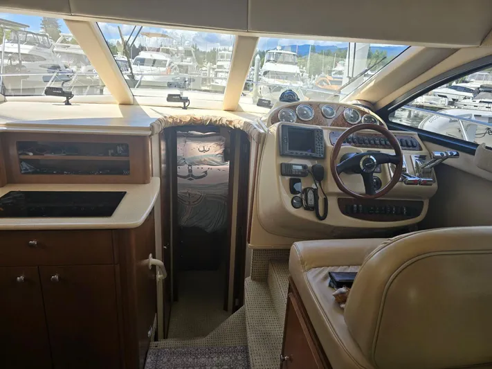 Why Not Yacht Photos Pics Interior of 2005 Meridian 381 Sedan yacht with helm and cabin view.