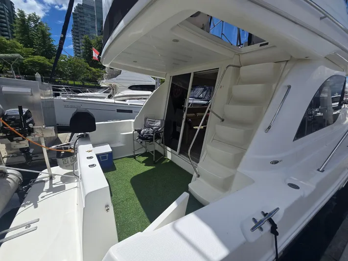 Why Not Yacht Photos Pics 2005 Meridian 381 Sedan yacht with outdoor seating and stairs, docked in a marina.