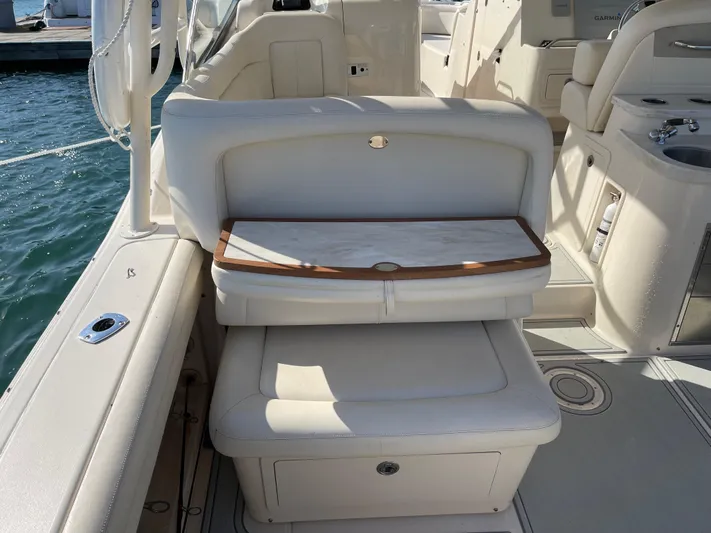  Yacht Photos Pics 2016 Grady-White Freedom 335 boat interior with cushioned seating and storage.