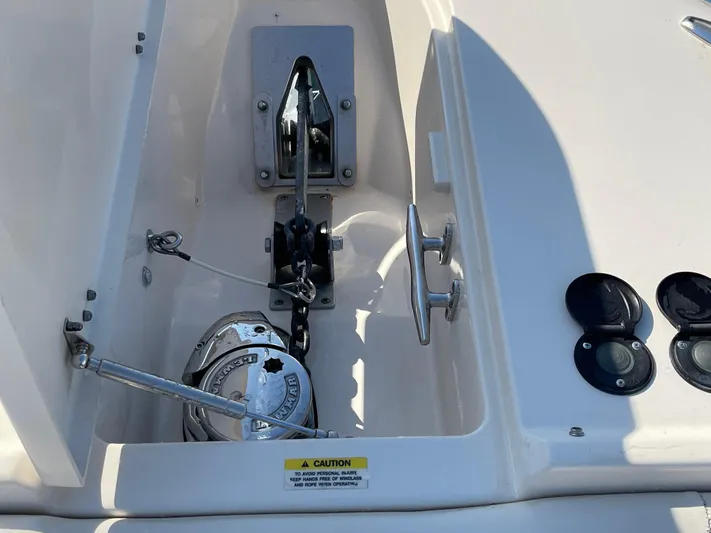  Yacht Photos Pics Anchor compartment of 2016 Grady-White Freedom 335 boat, featuring winch and controls.