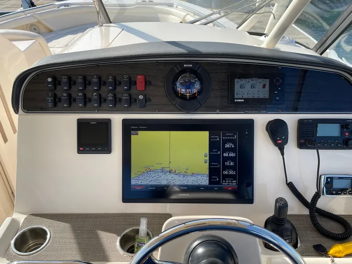  Yacht Photos Pics Control panel of 2016 Grady-White Freedom 335 boat with navigation equipment.
