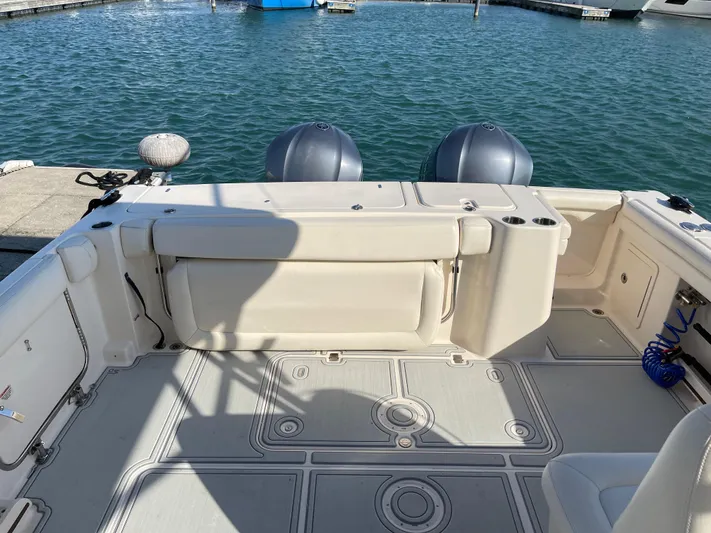  Yacht Photos Pics 2016 Grady-White Freedom 335 boat deck with twin engines at marina.