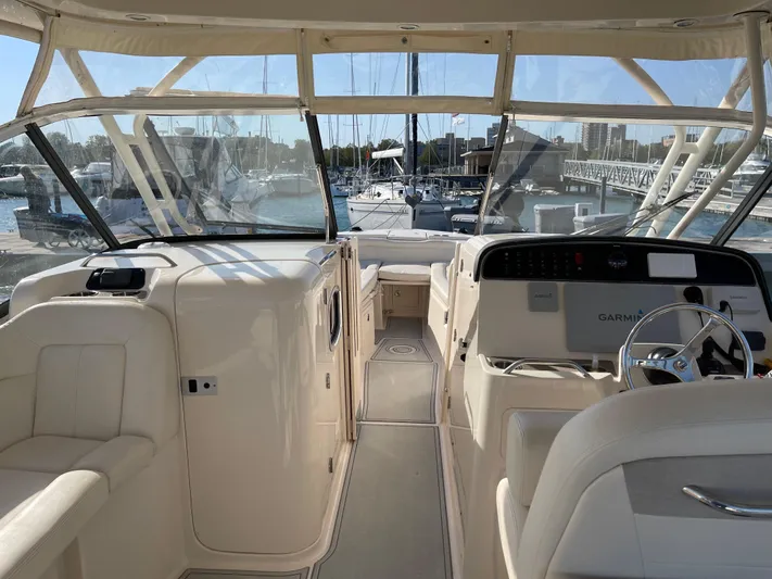  Yacht Photos Pics 2016 Grady-White Freedom 335 boat interior with helm, docked at marina.
