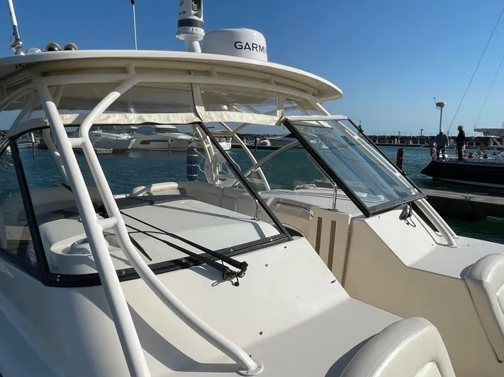  Yacht Photos Pics 2016 Grady-White Freedom 335 boat docked at marina, featuring Garmin equipment.