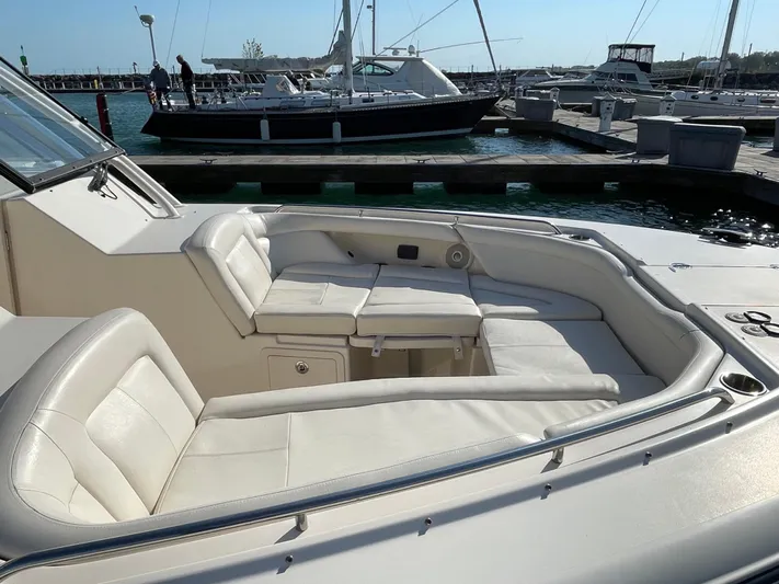  Yacht Photos Pics 2016 Grady-White Freedom 335 boat with spacious seating at a marina.