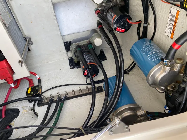  Yacht Photos Pics Engine compartment of a 2016 Grady-White Freedom 335 boat, showing wiring and components.
