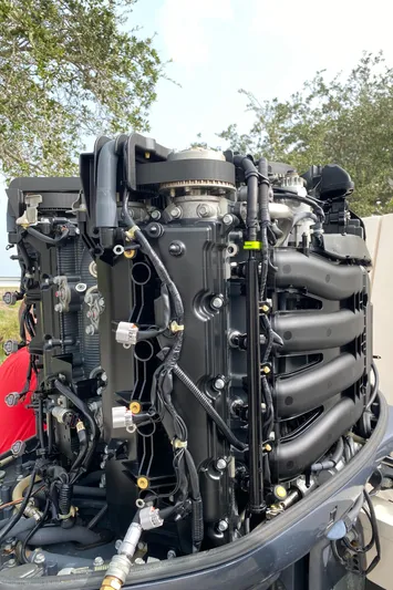  Yacht Photos Pics Close-up of a 2016 Grady-White Freedom 335 boat engine, showcasing intricate mechanical details.