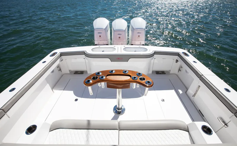 Code Blu Yacht Photos Pics 2022 Valhalla Boatworks 46 Center Console, spacious deck with triple engines, on open water.