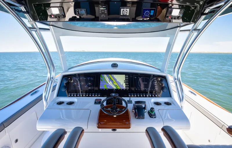 Code Blu Yacht Photos Pics 2022 Valhalla Boatworks 46 Center Console helm with advanced navigation system on open water.