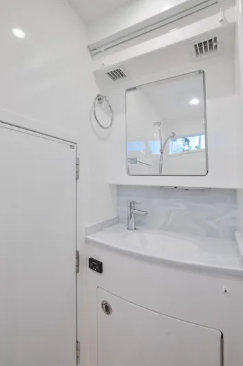 Code Blu Yacht Photos Pics 2022 Valhalla Boatworks 46 Center Console interior bathroom with modern sink and mirror.