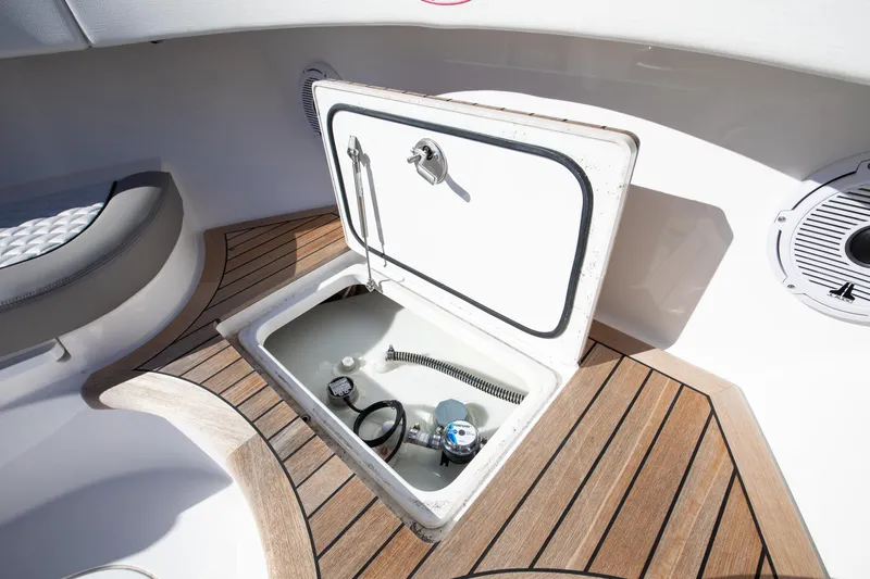 Code Blu Yacht Photos Pics Valhalla Boatworks 2022 46 Center Console storage compartment with teak flooring.