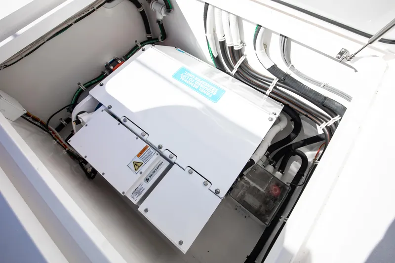 Code Blu Yacht Photos Pics Engine compartment of 2022 Valhalla Boatworks 46 Center Console, showcasing wiring and components.