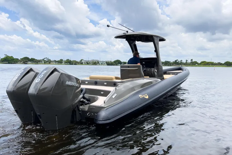 Airship 310 Yacht Photos Pics 2023 Airship 310 boat with dual Mercury engines on a calm lake.